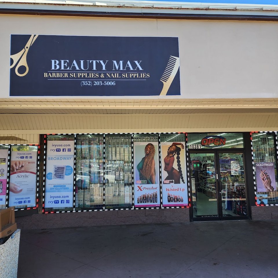 Organized store aisle with nails, eyelashes, and hair chemicals.