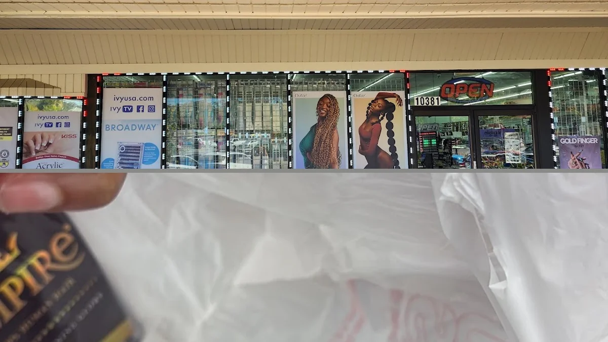 Retail shelves packed with beauty supplies and barber items.