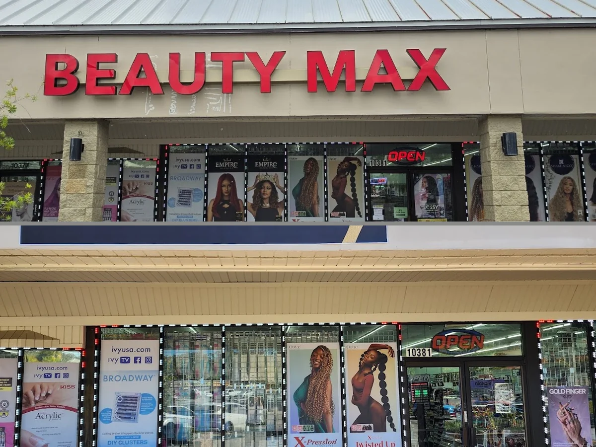 Beauty supply shelves with wigs, cosmetics, and hair products.